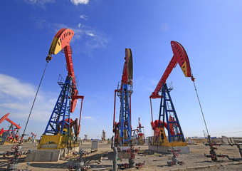 Oil pumps are working in the blue sky background