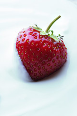 Strawberries with cream close-up.