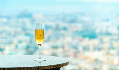 White wine on a table high above the city