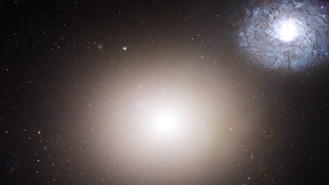 Galaxy Messier 60 slow rotating with flying stars in outer space, 3D animation. Contains public domain image by NASA