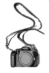 Modern digital camera on white background, only body shown