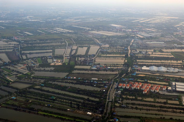 top view field roads and city, aerial photo from plane ,Thailand