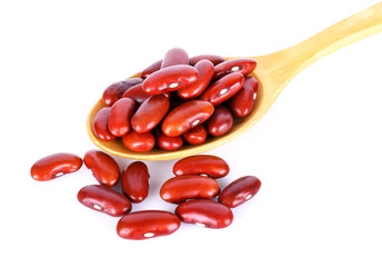 Red beans isolated in wood spoon on white background