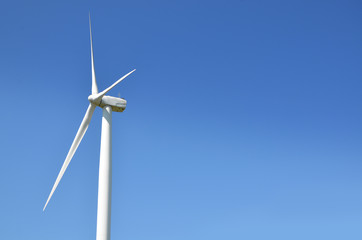 Wind Turbine Against Blue Sky