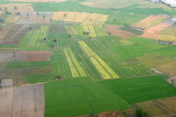 top view field roads and city, aerial photo from plane ,Thailand