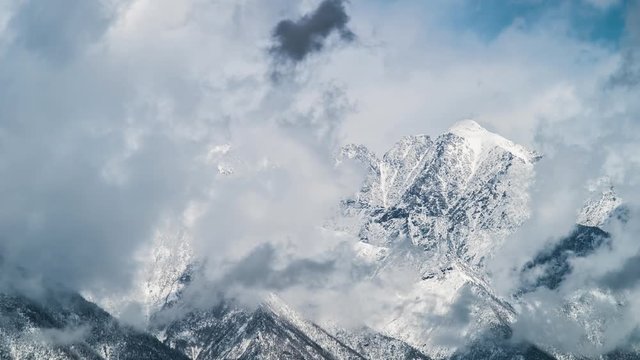 Time Lapse, winter mountains covered with snow in a mist