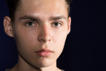 Fototapeta premium Dreamer. Attractive guy. Black background. 