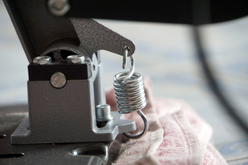 Closeup metal spring of sharpening knife machine use in house