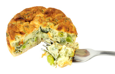 Crustless spinach and kale quiche isolated on a white background