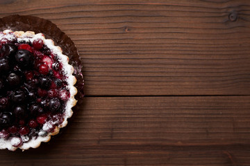 berry basket on wooden background