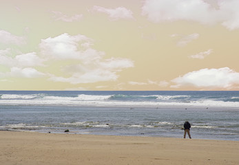 Walker on an empty beach