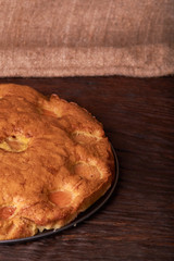 apricot cake on a dark wood background. tinting. selective focus