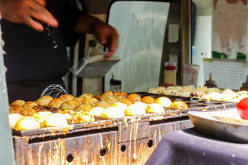 Process to Cooking Takoyaki on hot pan Famous food in Japan street food