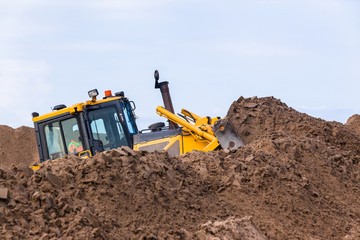 Earthworks  Industrial Dozer Machine Pushing Sand Closeup.