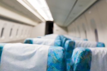 Abstract blurred Inside of train with empty seats interior blur background.