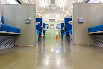 Fototapeta na wymiar Interior of electric train with empty seats business transportation background.