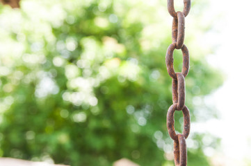 Rusty chain close up shot on natural light, shallow depth of field