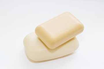 Hygiene toilet soap white and cream for children, close - up, isolated on a white background
