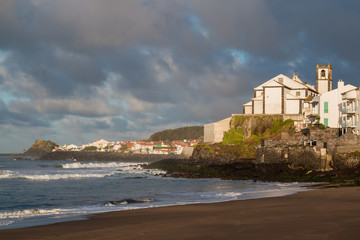 Fototapeta na wymiar Atlantic ocean and a church on a hill