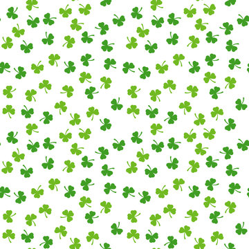 Seamless pattern of clover leaves. Random floral vector background. Green plant. Traditional Iraland holiday symbol. Saint Patric day. Lucky or fortune token. Summer coordinating ornament.