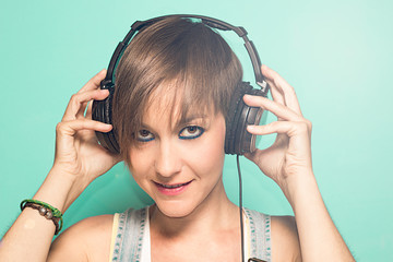 Fototapeta premium Modern girl with music headphones