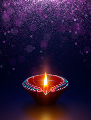 Diya lamp with glitter light background