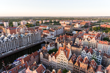 Fototapeta premium Photo of the old town of Gdansk architecture in sunset light. Aerial shot. Channel and buildings - top view