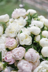 Obraz na płótnie Canvas Beautiful bouquet of white and pink peonies . Floral composition, daylight. Wallpaper. Vertical photo