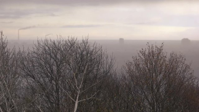 Mist above industrial city. Cloudy and depressive landscape.