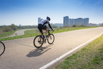 Obraz premium fully equipped cyclist riding a bicycle