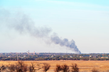 Fototapeta na wymiar Smoke from a fire in the distance