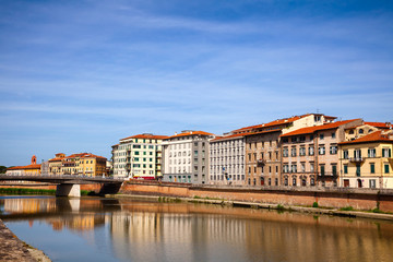 Waterfront buildings on Arno River embankment Pisa Tuscany Italy
