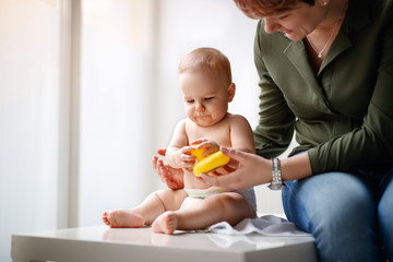 Obraz na płótnie Canvas Baby playing with toy