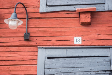 Number 18 and lamp on red wall