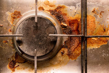 dirty gas cooker, close-up, top view.