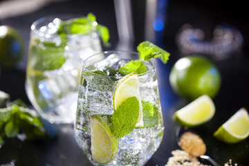 Closeup of mojito cocktails. Ingredients and utensils.