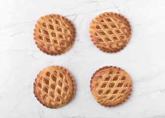 group of homemade cookies on white marble