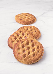 group of homemade cookies on white marble