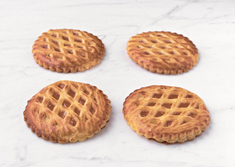 group of homemade cookies on white marble