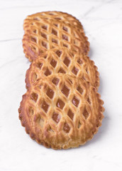 group of homemade cookies on white marble