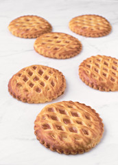 group of homemade cookies on white marble