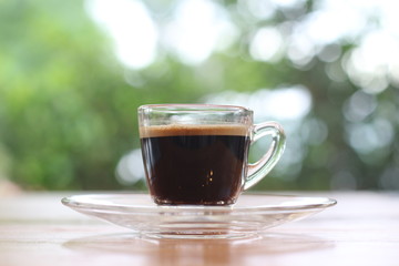 Black coffee is placed on the table.