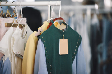 Women clothing on hangers in a boutique store