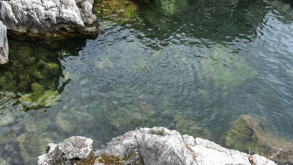 Clear and crystalline sea with rocks