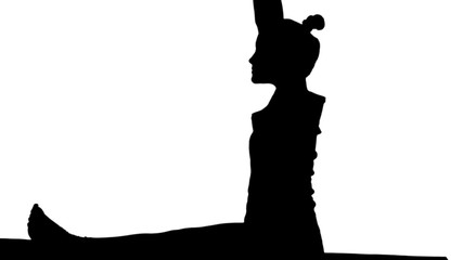 Young woman stretching leg on mat, practicing yoga track matte