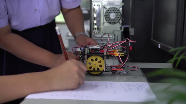 Learning STEM Education robotics project concept: Asian Student group creating and studying for innovation robot model ipst that Study generation for DIY electronic Kit in 21st education classroom