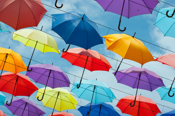 Colorful umbrellas background. Colorful umbrellas in the sky. Street decoration.