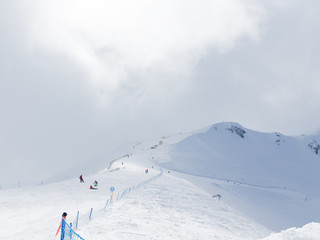 Fototapeta na wymiar Mountain skiers in the mountains in Sochi