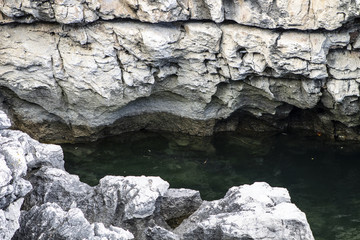 Clear and crystalline sea with rocks