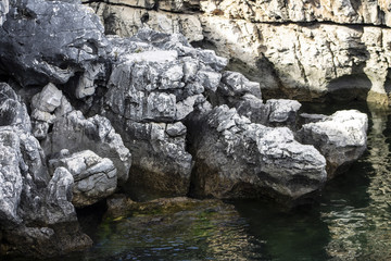 Clear and crystalline sea with rocks